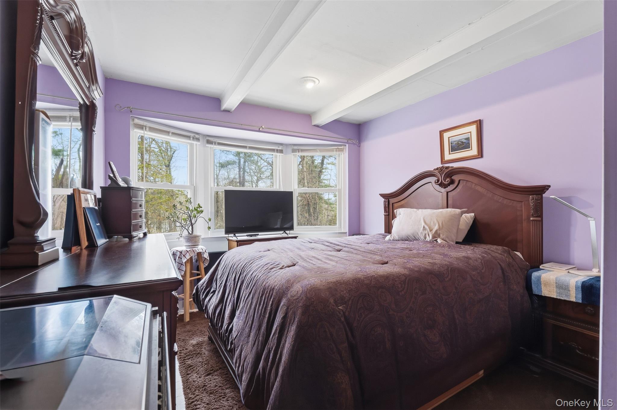 51 Johnson Street Lake Peekskill, NY 10537 - Photo 8 of 29 a bedroom with a bed and glass windows