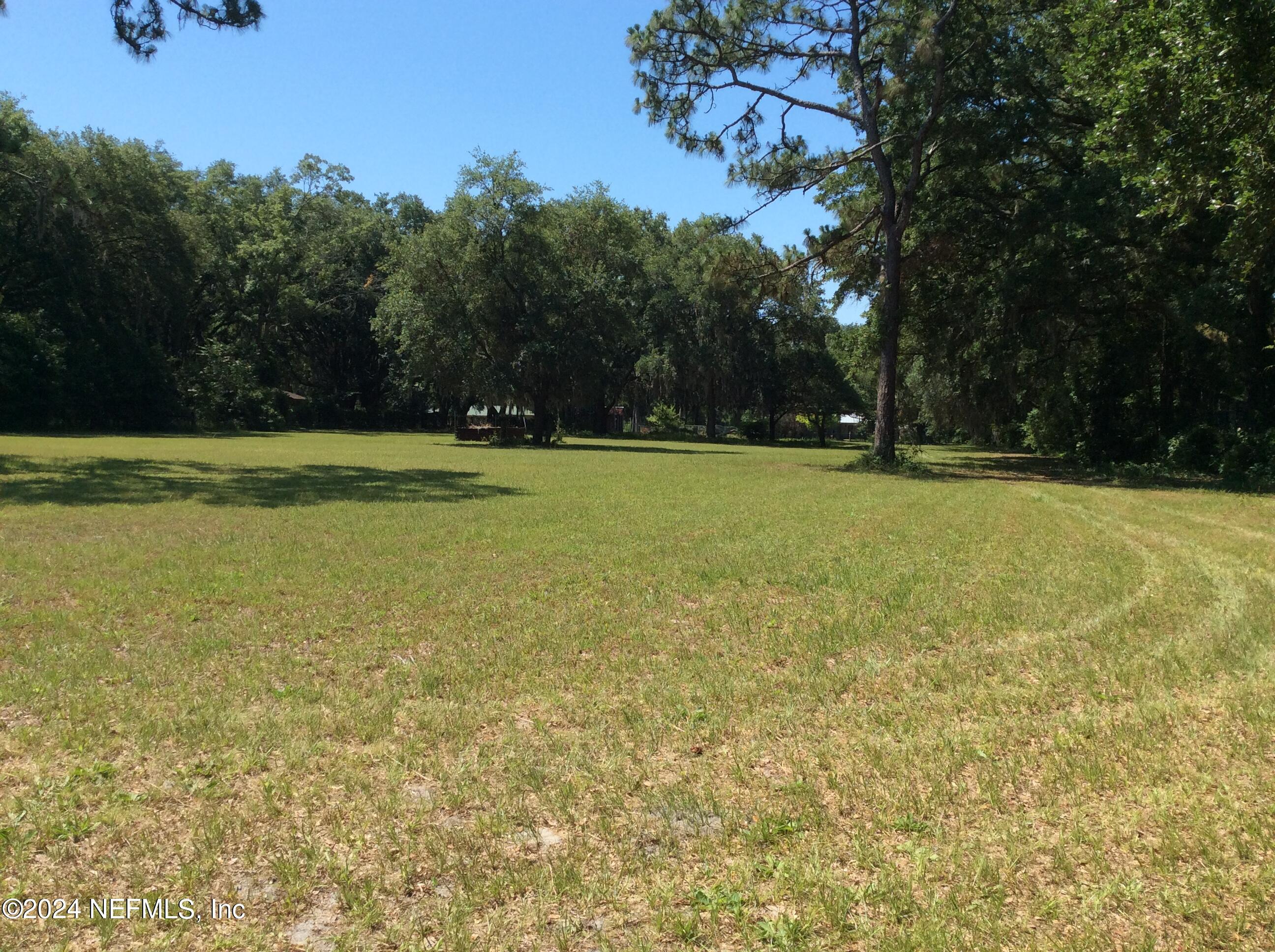 3207 Fritz Road Jacksonville, FL 32226 - Photo 4 of 8 a view of a field with an trees