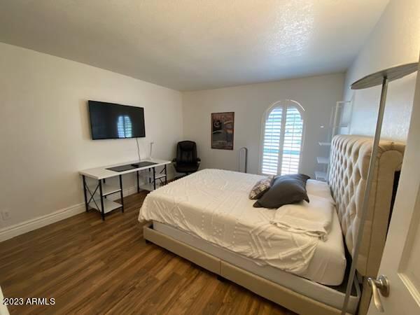 11222 North Miller Road Scottsdale, AZ 85260 - Photo 20 of 32 a bedroom with a bed and a television