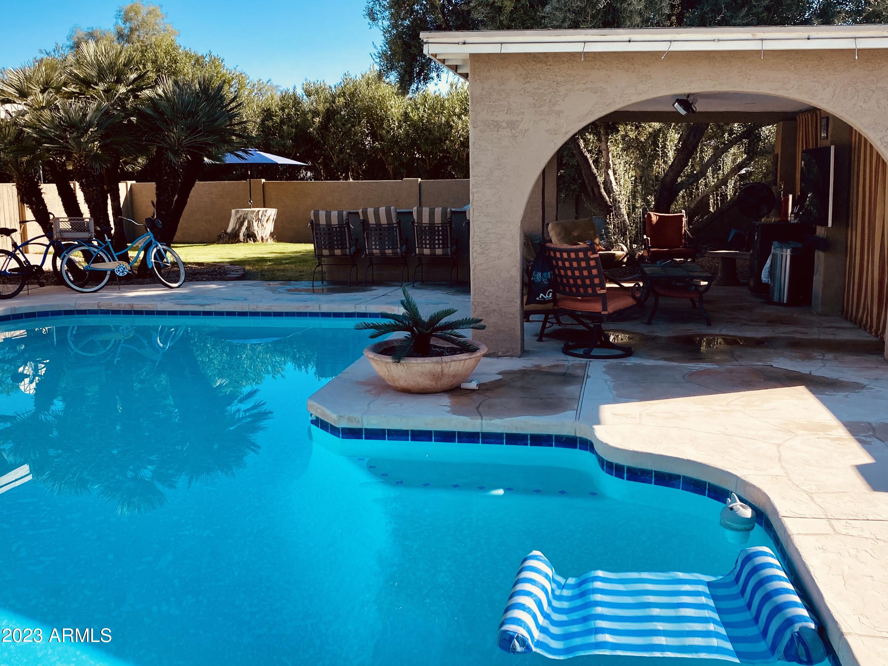 11222 North Miller Road Scottsdale, AZ 85260 - Photo 2 of 32 a view of swimming pool with a patio