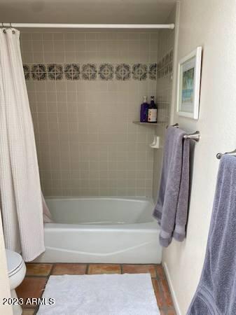 11222 North Miller Road Scottsdale, AZ 85260 - Photo 22 of 32 a bathroom with a shower and a bath tub