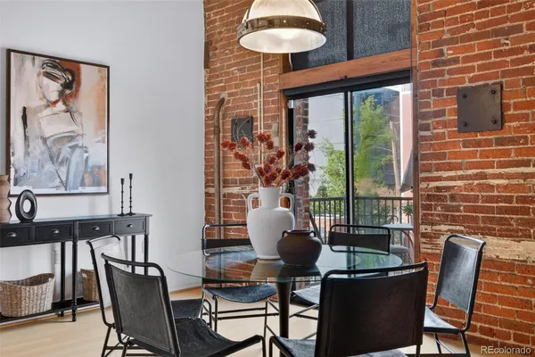 a dining room with furniture and window