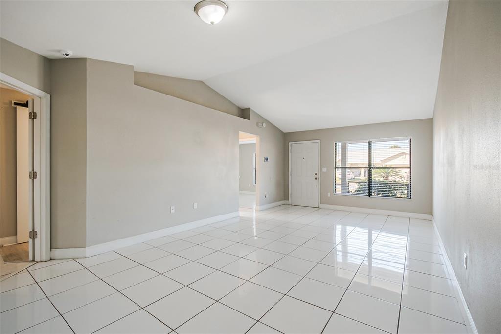 117 Pansy Court Kissimmee, FL 34743 - Photo 14 of 40 a view of an empty room and window