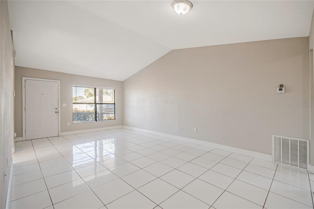 117 Pansy Court Kissimmee, FL 34743 - Photo 15 of 40 a view of an empty room with a window