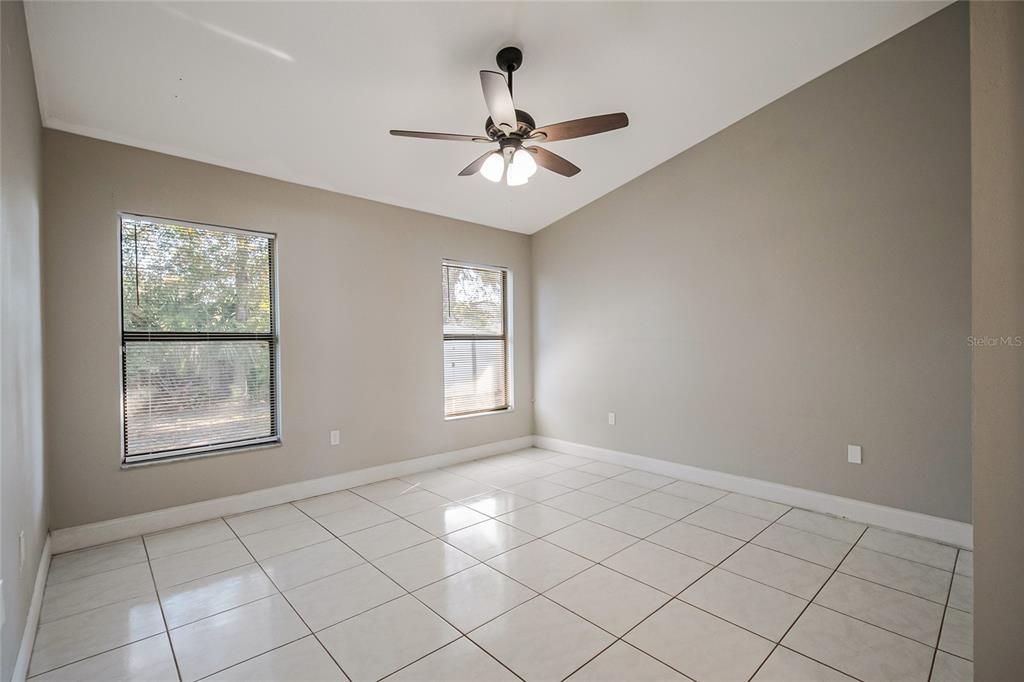 117 Pansy Court Kissimmee, FL 34743 - Photo 16 of 40 a view of an empty room with a window