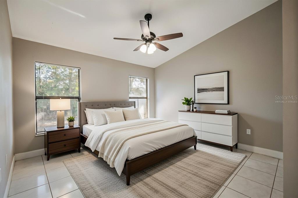 117 Pansy Court Kissimmee, FL 34743 - Photo 19 of 40 a bedroom with a bed and a window