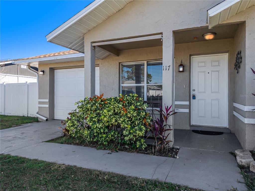 117 Pansy Court Kissimmee, FL 34743 - Photo 2 of 40 a front view of a house with a yard