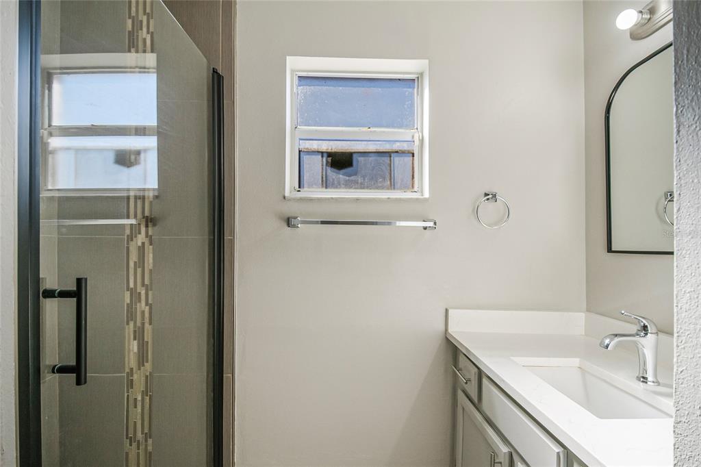 117 Pansy Court Kissimmee, FL 34743 - Photo 21 of 40 a bathroom with a sink and a mirror