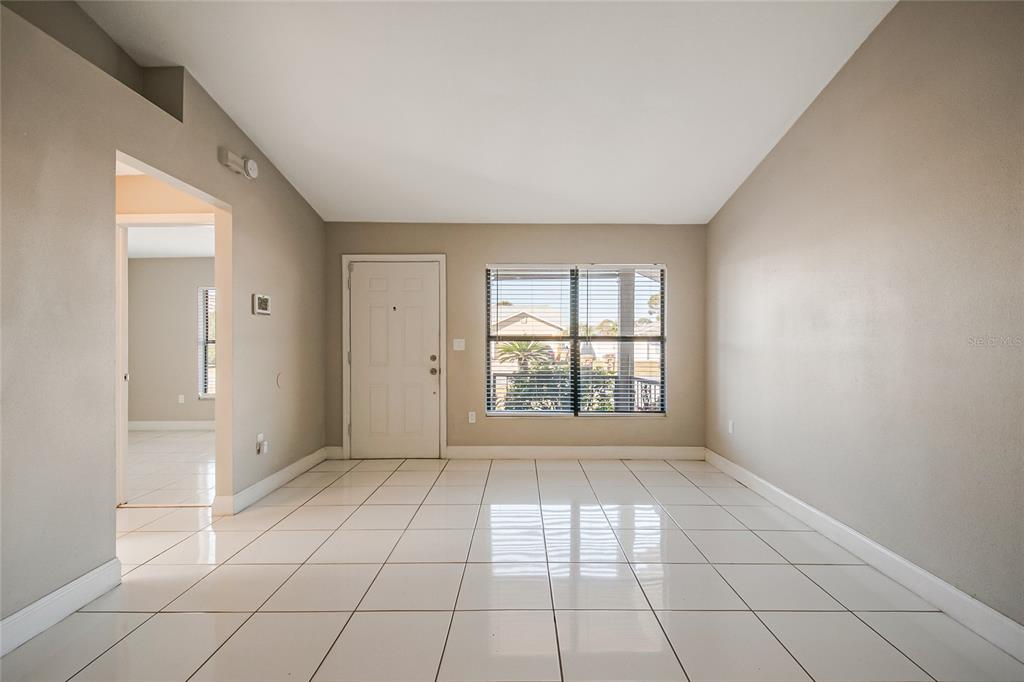 117 Pansy Court Kissimmee, FL 34743 - Photo 7 of 40 a view of an empty room with a window