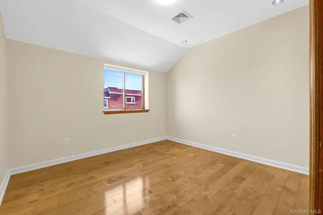 a bathroom with a granite countertop sink mirror and shower