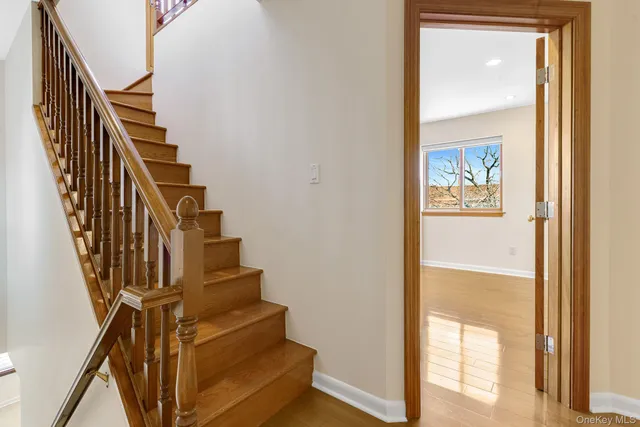 a view of a workspace with furniture and wooden floor
