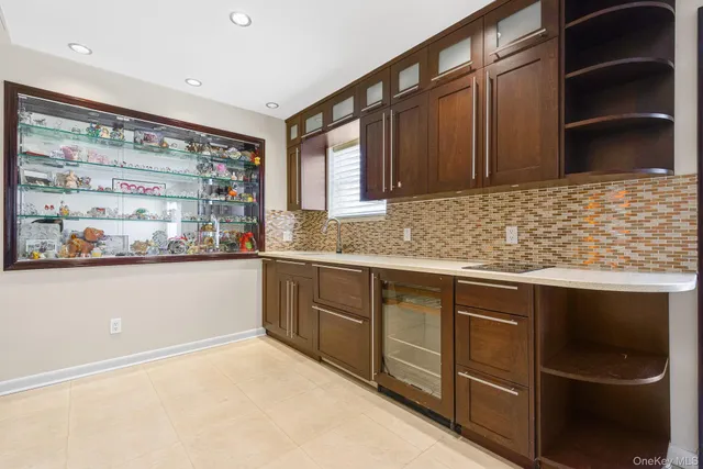 a bathroom with a sink toilet a mirror and shower