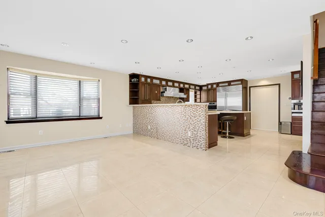 a kitchen with granite countertop a sink and a stove