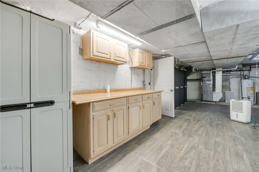 2524 Claver Road Cleveland, OH 44118 - Photo 45 of 50 Below grade area featuring heating unit, light wood-style flooring, and gas water heater