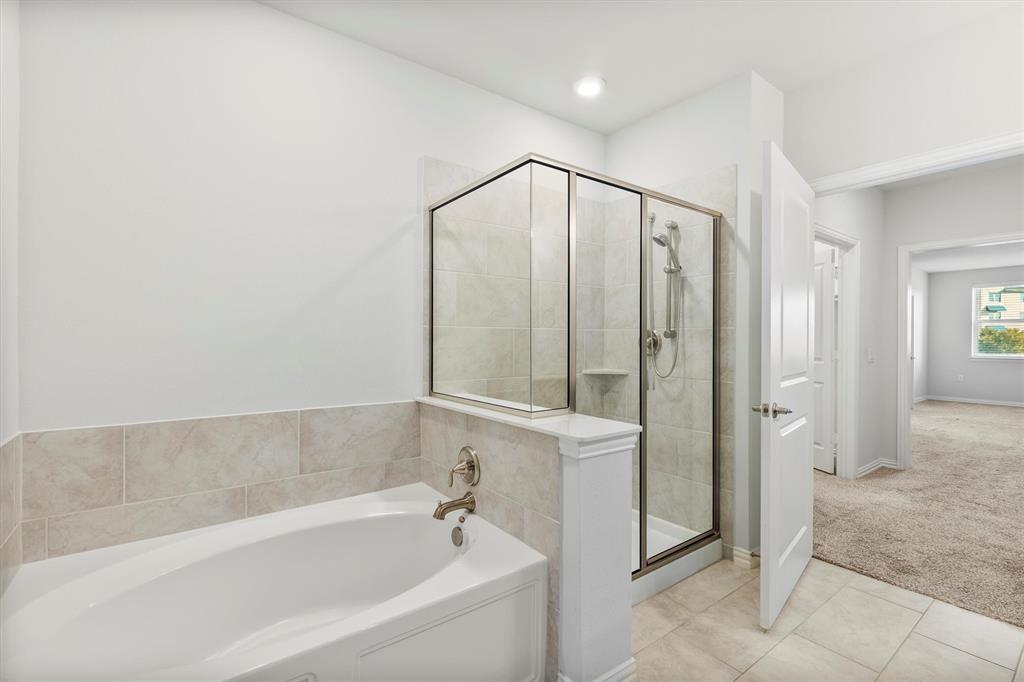 651 Watters Road, Unit 7202 Allen, TX 75013 - Photo 17 of 33 a spacious bathroom with a bathtub and a shower