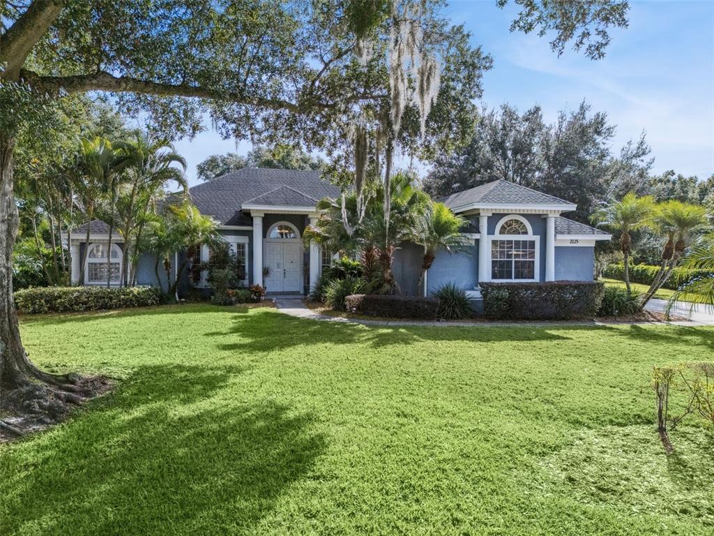 2125 Kane Park Way Windermere, FL 34786 - Photo 1 of 63 a front view of a house with a yard