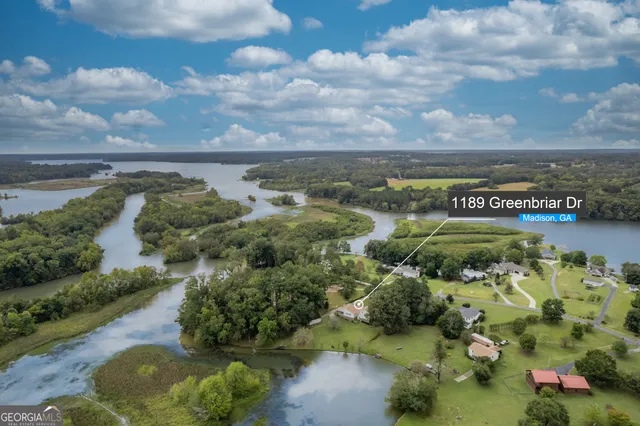 an aerial view of a houses with yard