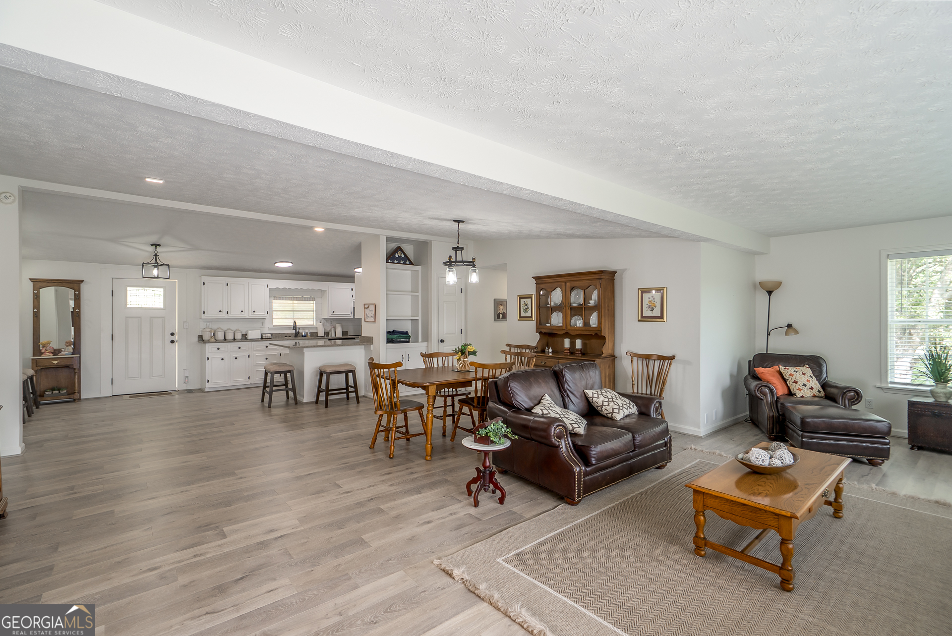 1180 Greenbriar Drive Madison, GA 30650 - Photo 12 of 54 a living room with furniture and a table