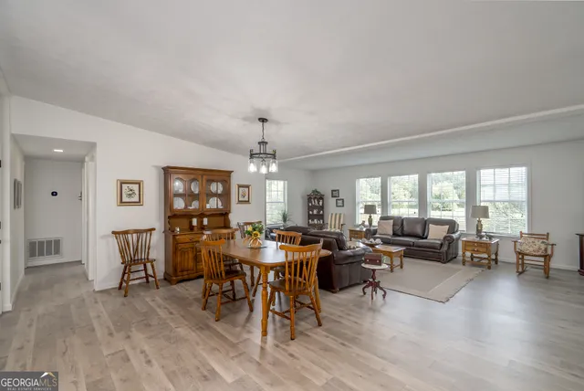 a kitchen with sink stove and cabinets