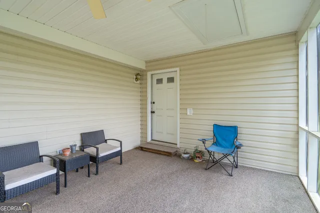 a bedroom with a bed and a large mirror with dresser