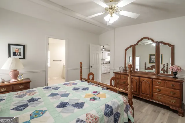 a bathroom with a bathtub shower and a toilet