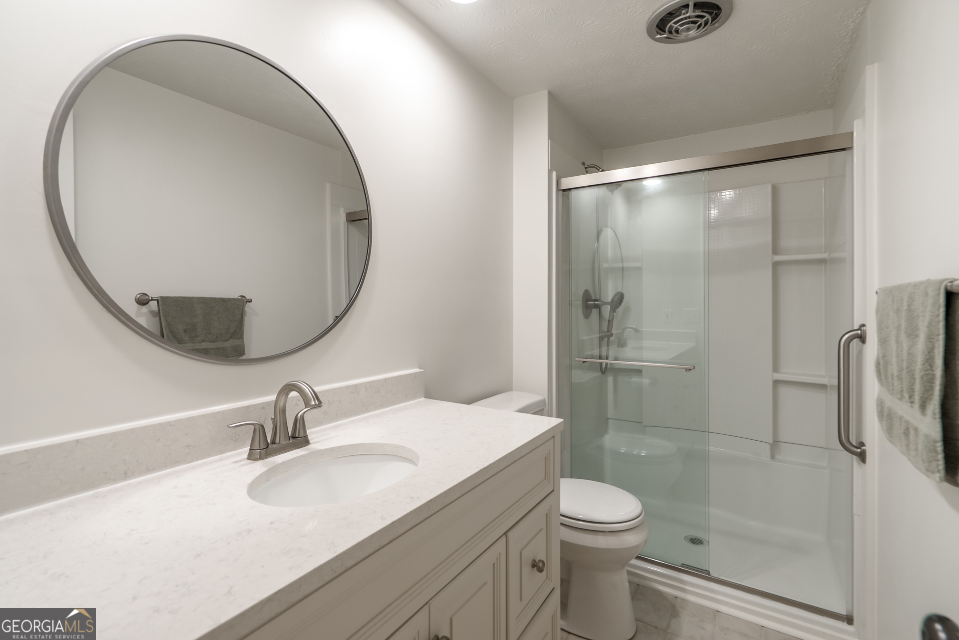 1180 Greenbriar Drive Madison, GA 30650 - Photo 27 of 54 a bathroom with a sink toilet and shower
