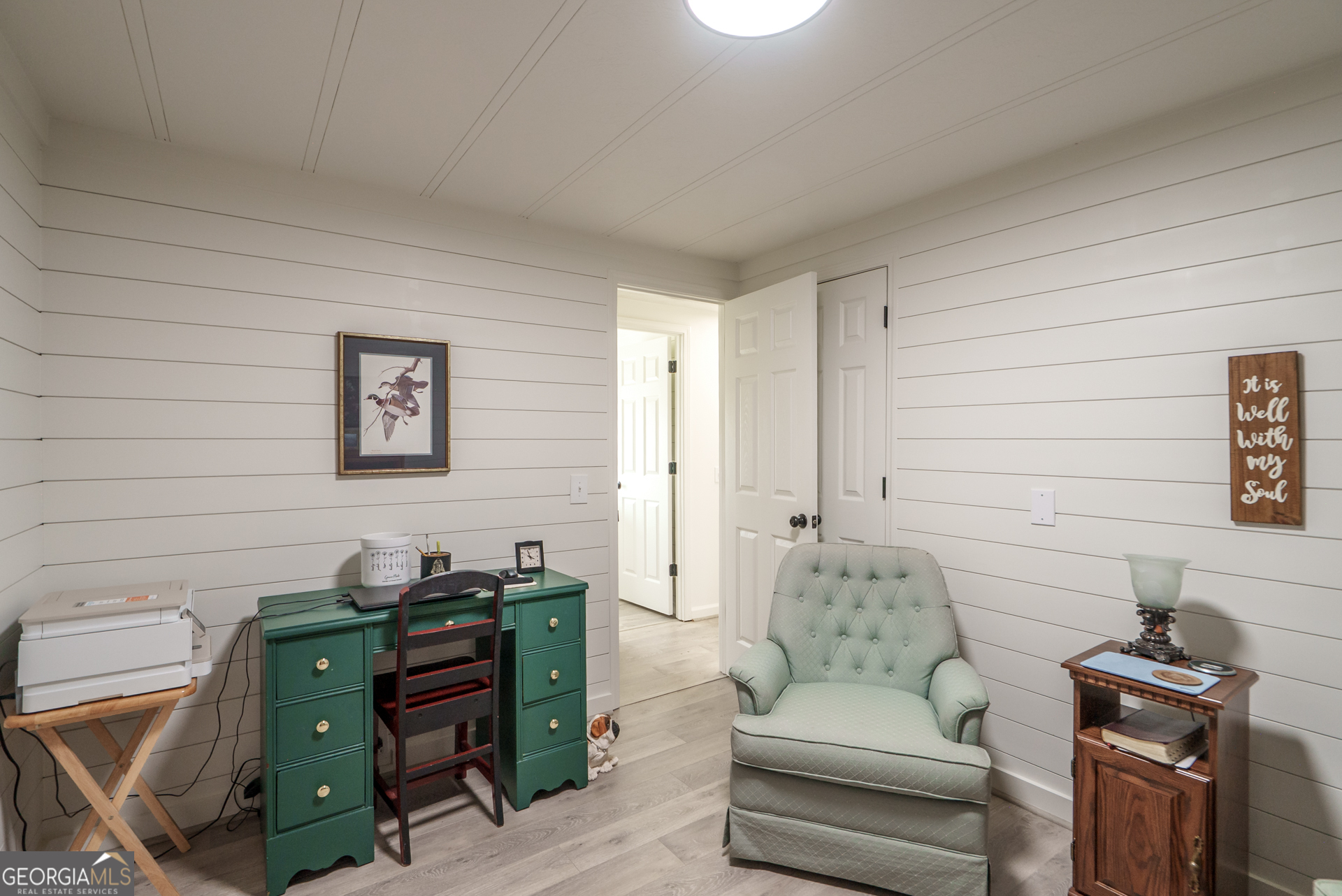 1180 Greenbriar Drive Madison, GA 30650 - Photo 31 of 54 a living room with furniture and a flat screen tv