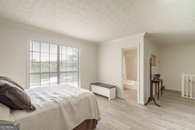 a bathroom with a sink toilet vanity and shower