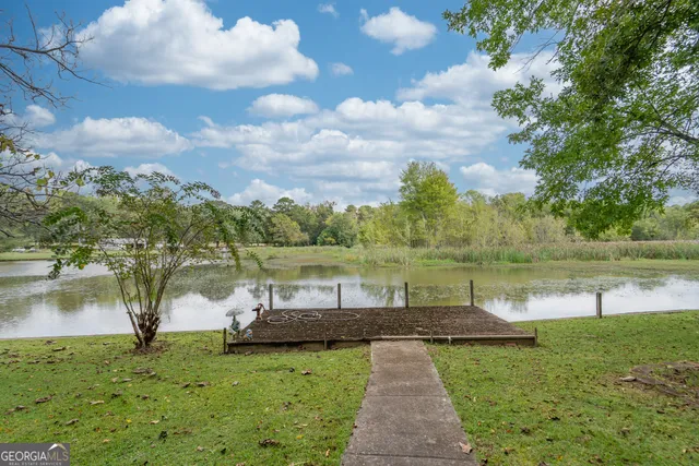 a view of outdoor space with wooden floor and outdoor seating