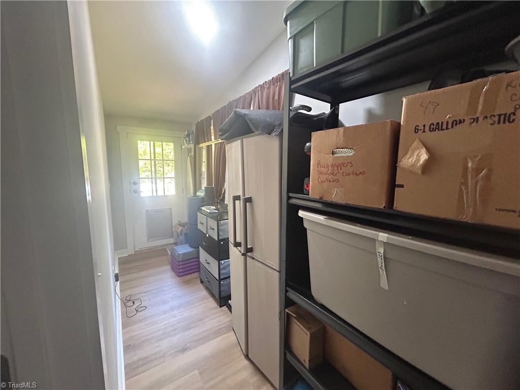 4016 High Rock Road Gibsonville, NC 27249 - Photo 23 of 41 Climate controlled storage room - exterior door has dog door installed.