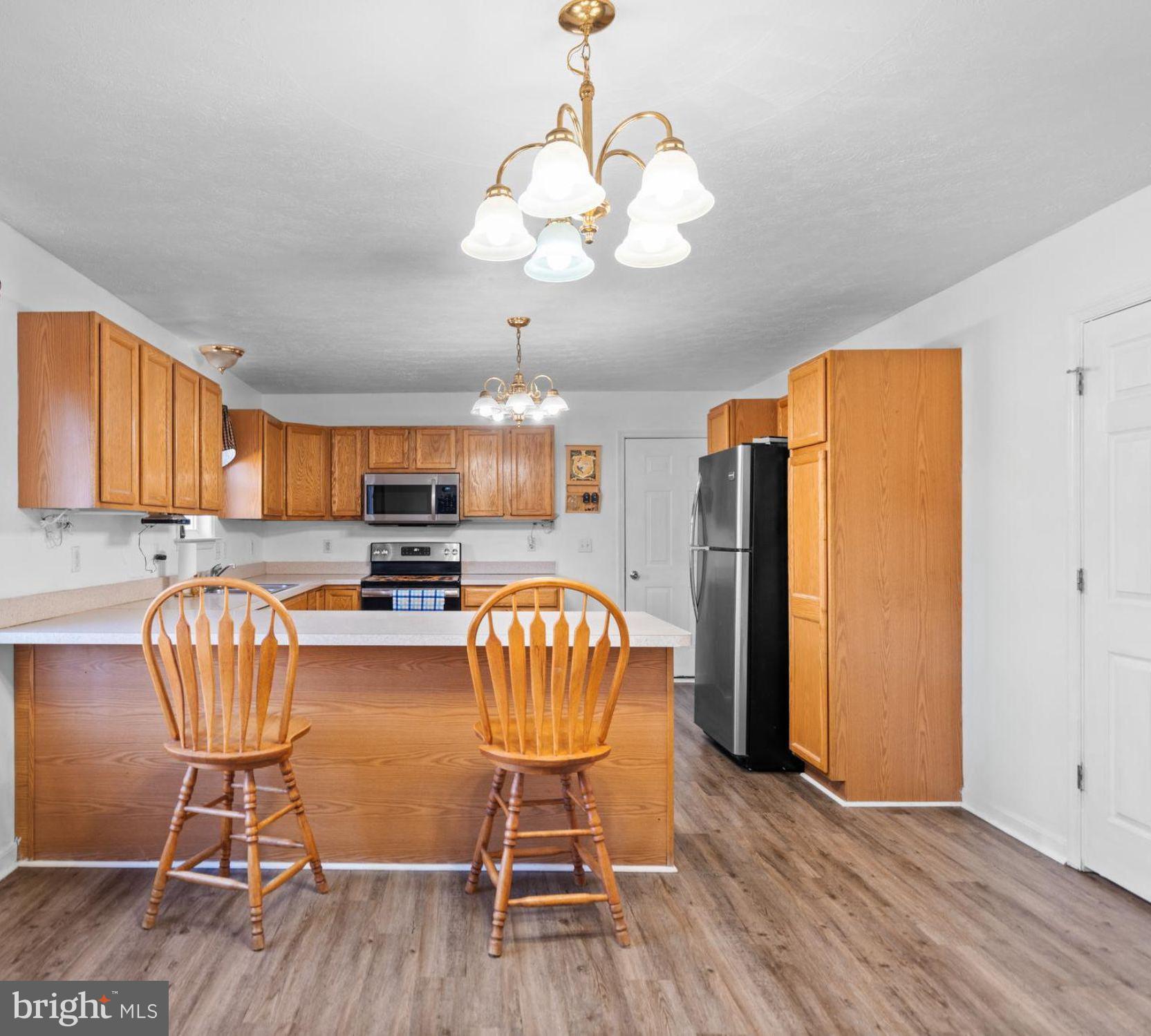 2158 Star Tannery Road Star Tannery, VA 22654 - Photo 2 of 23 a view of a dining room with furniture and wooden floor