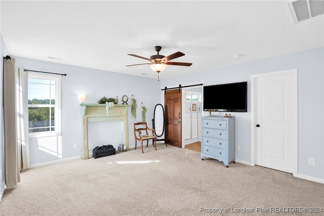 11 Rainmaker Street Linden, NC 28356 - Photo 14 of 32 a living room with furniture and a flat screen tv