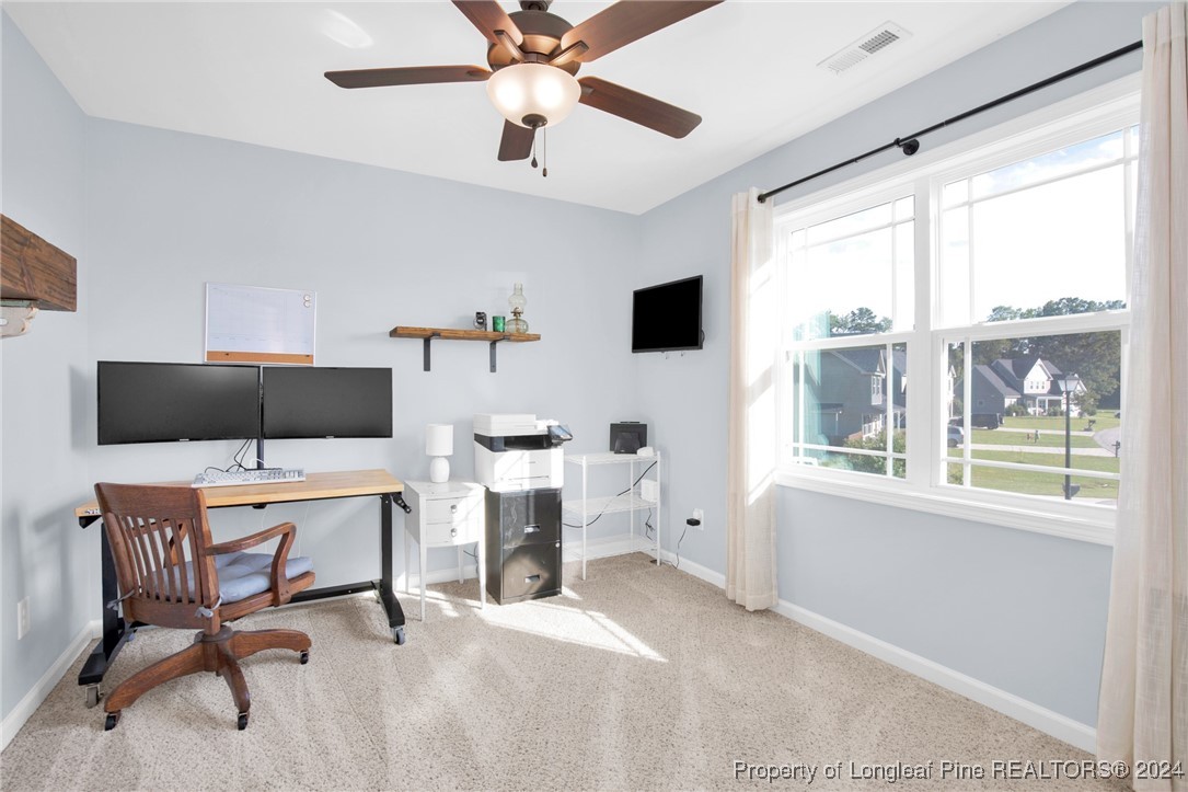 11 Rainmaker Street Linden, NC 28356 - Photo 18 of 32 a view of a workspace with furniture and a window