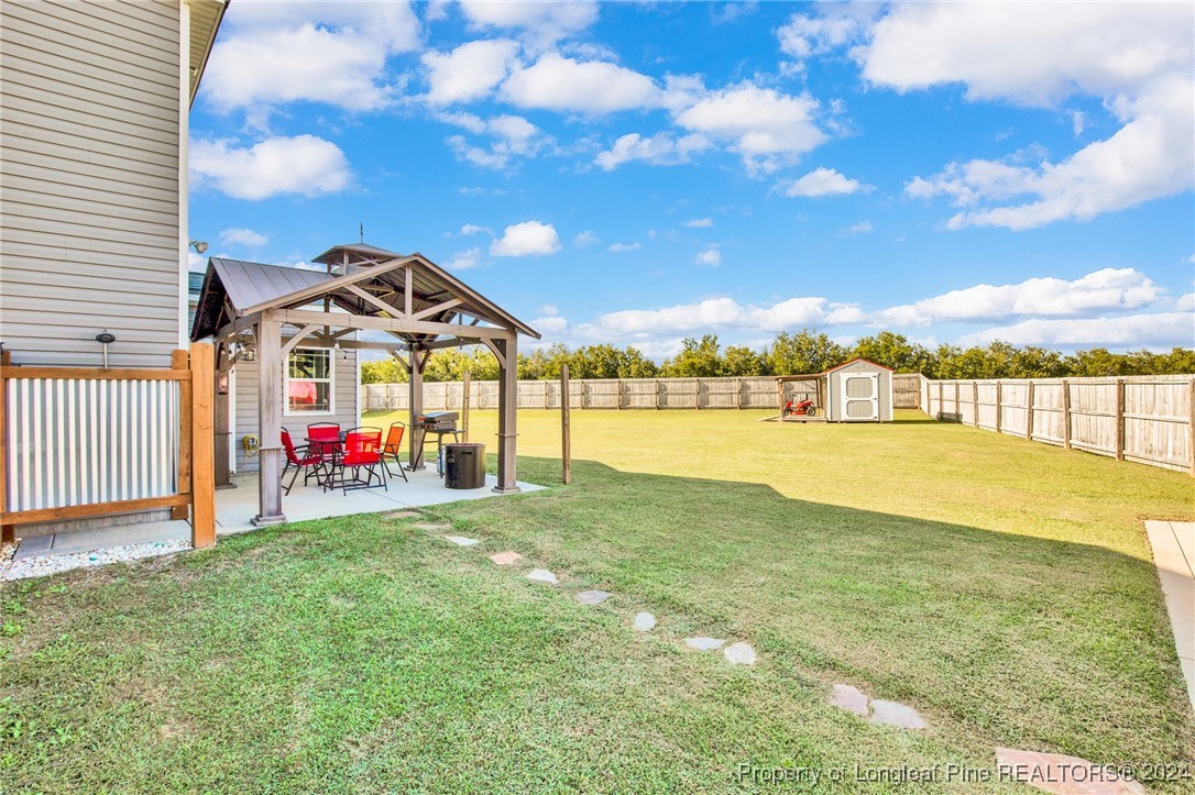 11 Rainmaker Street Linden, NC 28356 - Photo 25 of 32 a view of swimming pool with an outdoor space and seating area