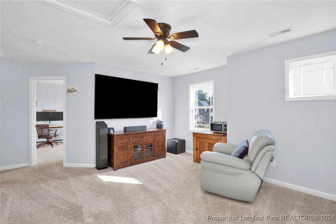 11 Rainmaker Street Linden, NC 28356 - Photo 10 of 32 a living room with furniture and a flat screen tv