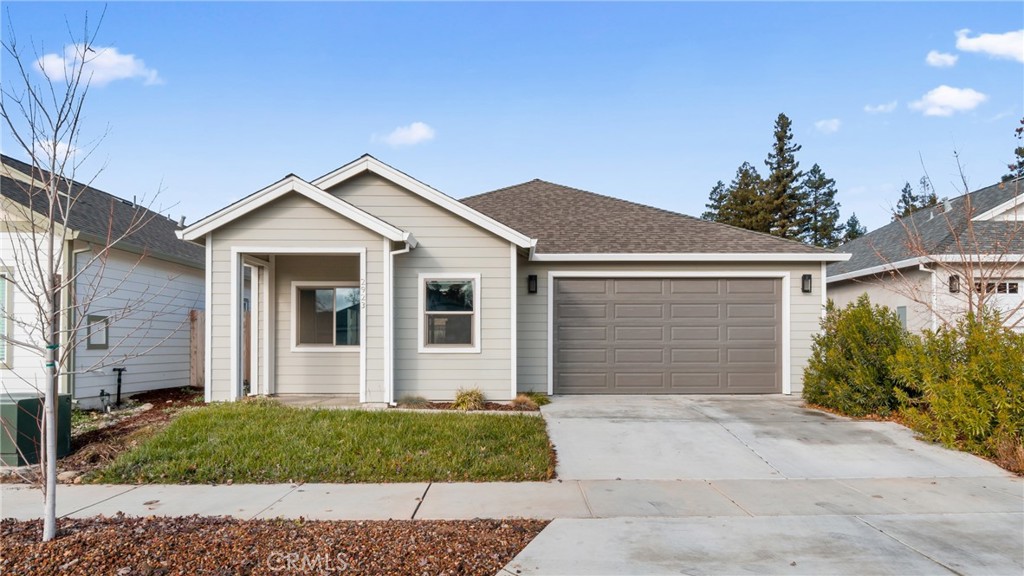 a front view of a house with a garden