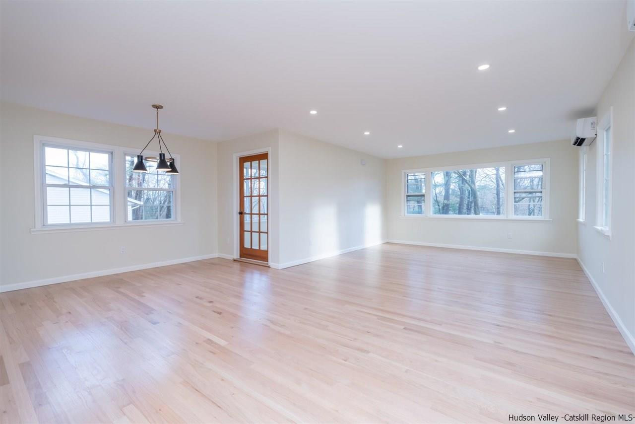 20 Robin Lane Kingston, NY 12401 - Photo 13 of 35 a view of an empty room with a window and wooden floor