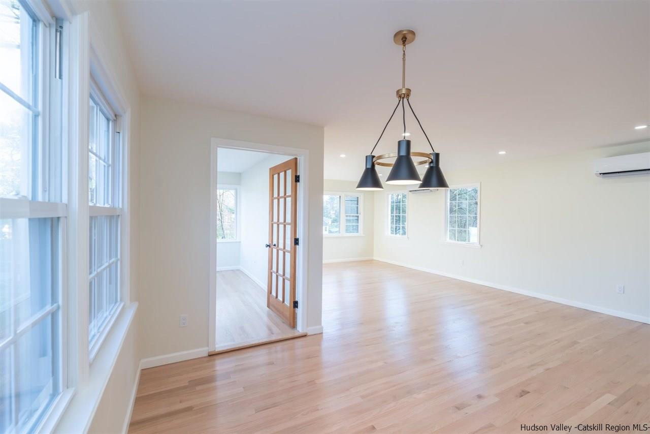 20 Robin Lane Kingston, NY 12401 - Photo 15 of 35 a view of a room with wooden floor staircase and a view of hallway