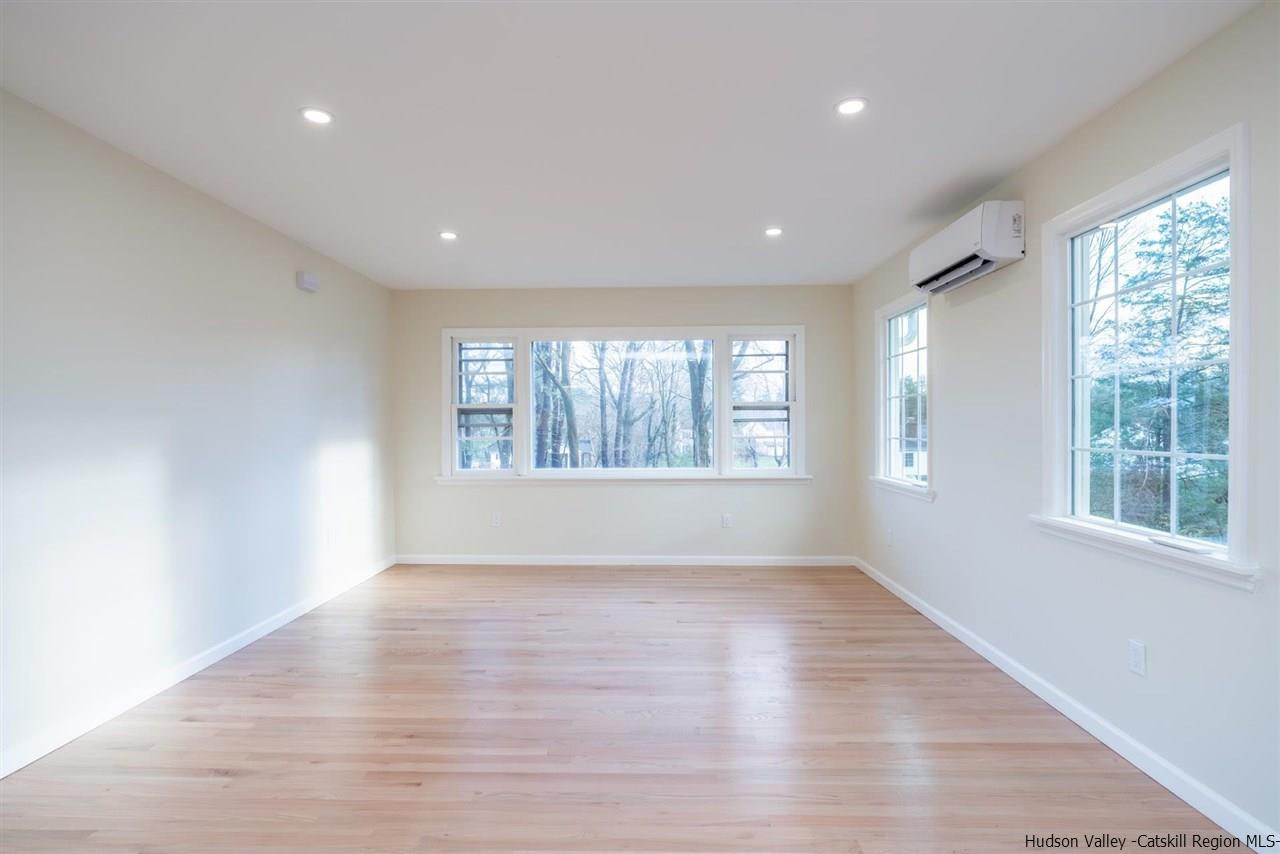 20 Robin Lane Kingston, NY 12401 - Photo 17 of 35 wooden floor in an empty room with a window