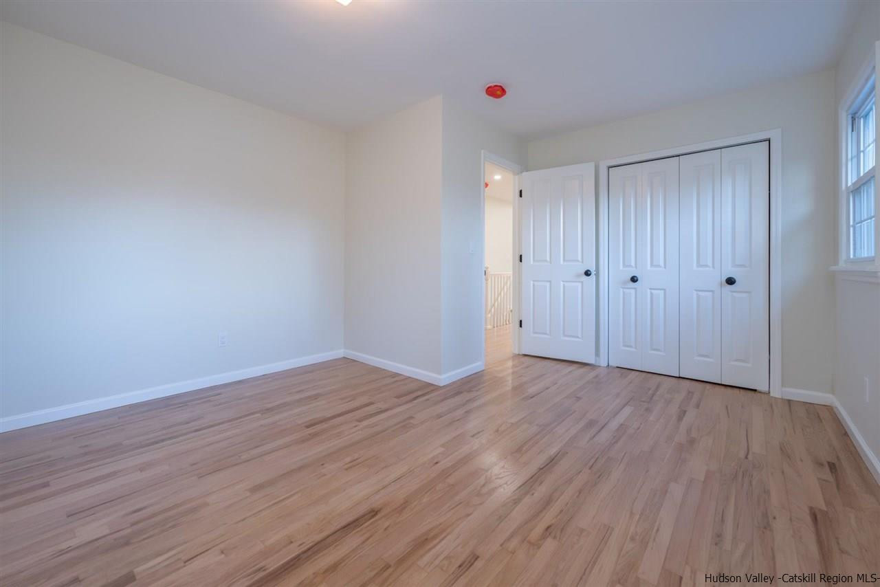 20 Robin Lane Kingston, NY 12401 - Photo 21 of 35 a view of an empty room with wooden floor