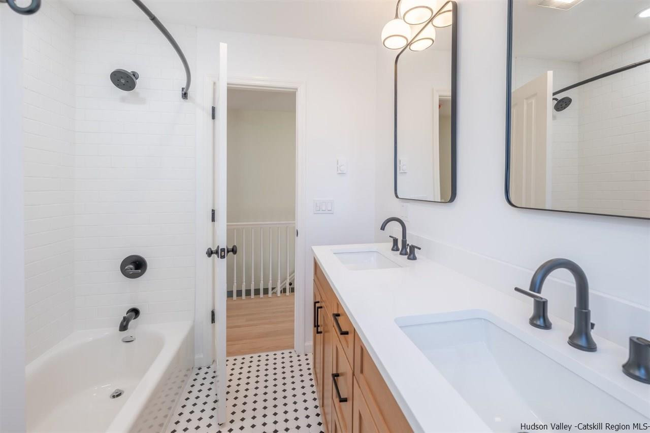 20 Robin Lane Kingston, NY 12401 - Photo 23 of 35 a bathroom with a sink a toilet and shower