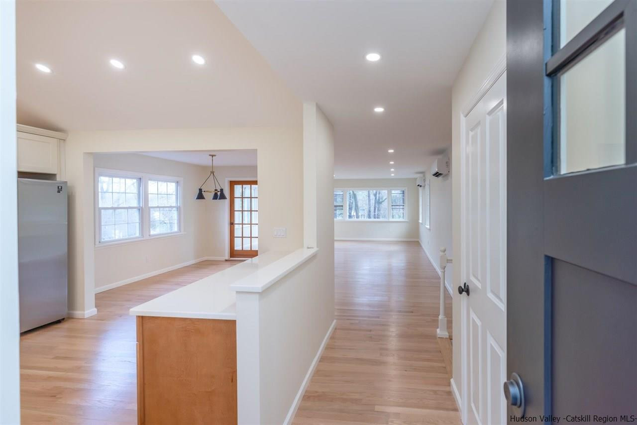 20 Robin Lane Kingston, NY 12401 - Photo 4 of 35 a view of a hallway with wooden floor and staircase