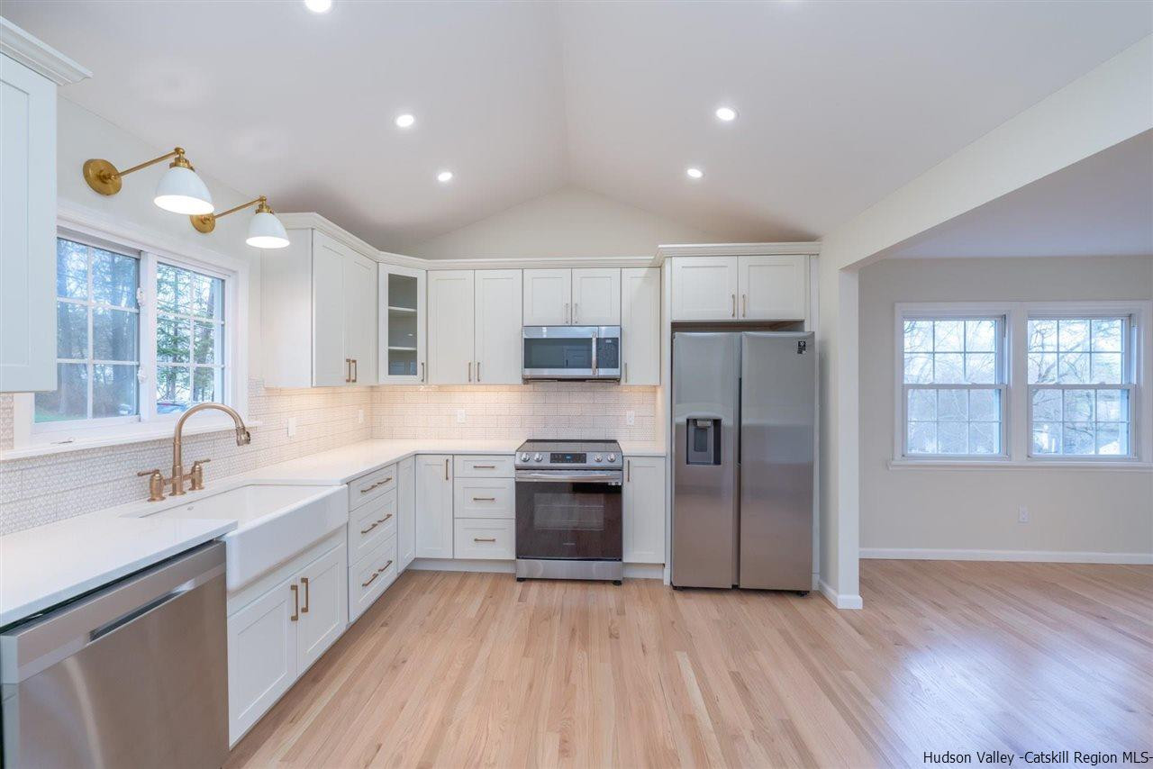 20 Robin Lane Kingston, NY 12401 - Photo 7 of 35 a large kitchen with cabinets stainless steel appliances and a window