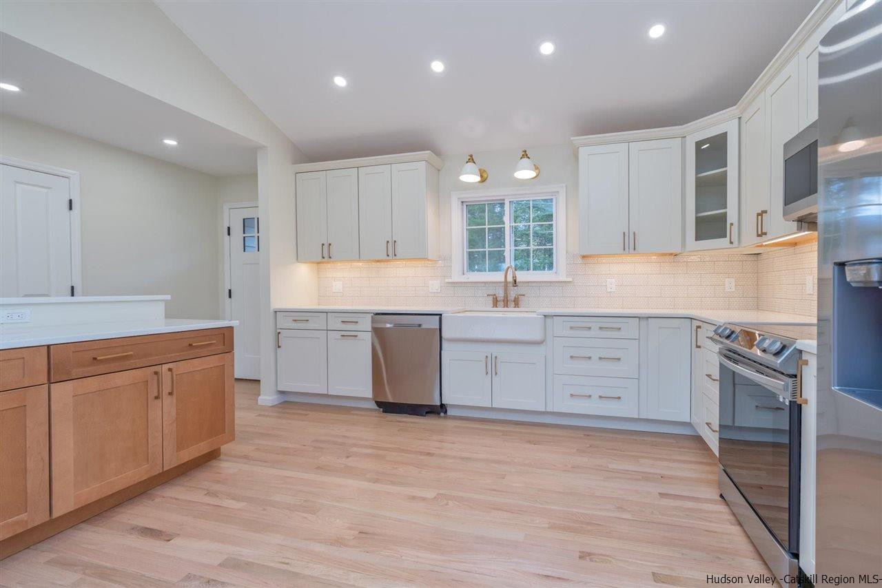 20 Robin Lane Kingston, NY 12401 - Photo 10 of 35 a kitchen with granite countertop a sink stainless steel appliances and cabinets