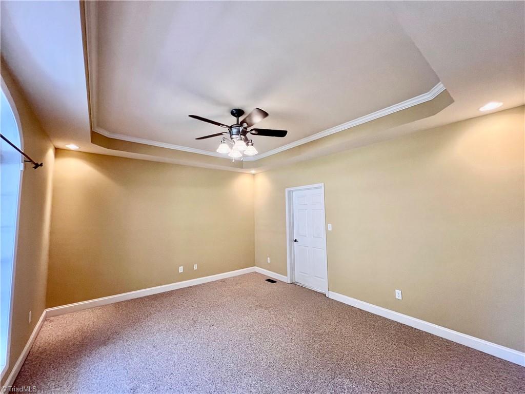 1114 Red Top Road Wilkesboro, NC 28697 - Photo 15 of 29 Very spacious primary bedroom has tray ceiling.