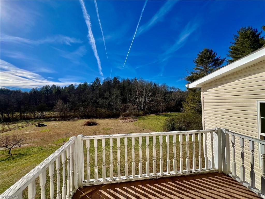 1114 Red Top Road Wilkesboro, NC 28697 - Photo 22 of 29 Back deck overlooking pasture/field going down to the creek.