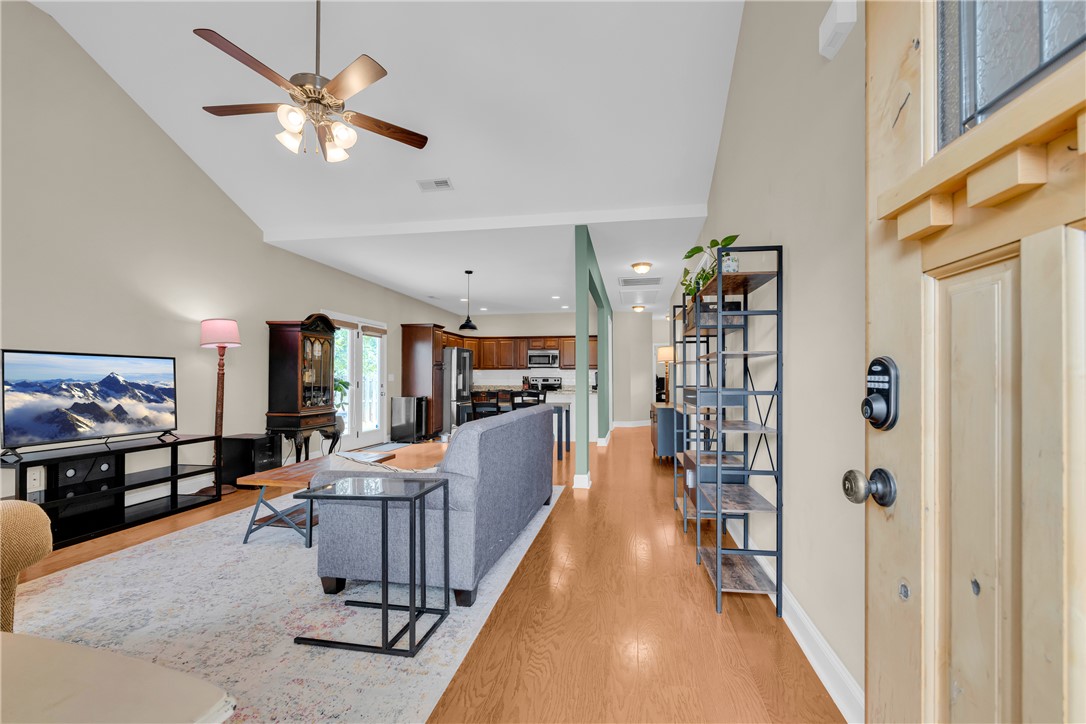 5 Drakeford Court Anderson, SC 29621 - Photo 9 of 46 Soaring ceilings and warm hardwood floors define this inviting, open-concept living area.