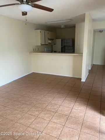 a view of a kitchen with kitchen appliances