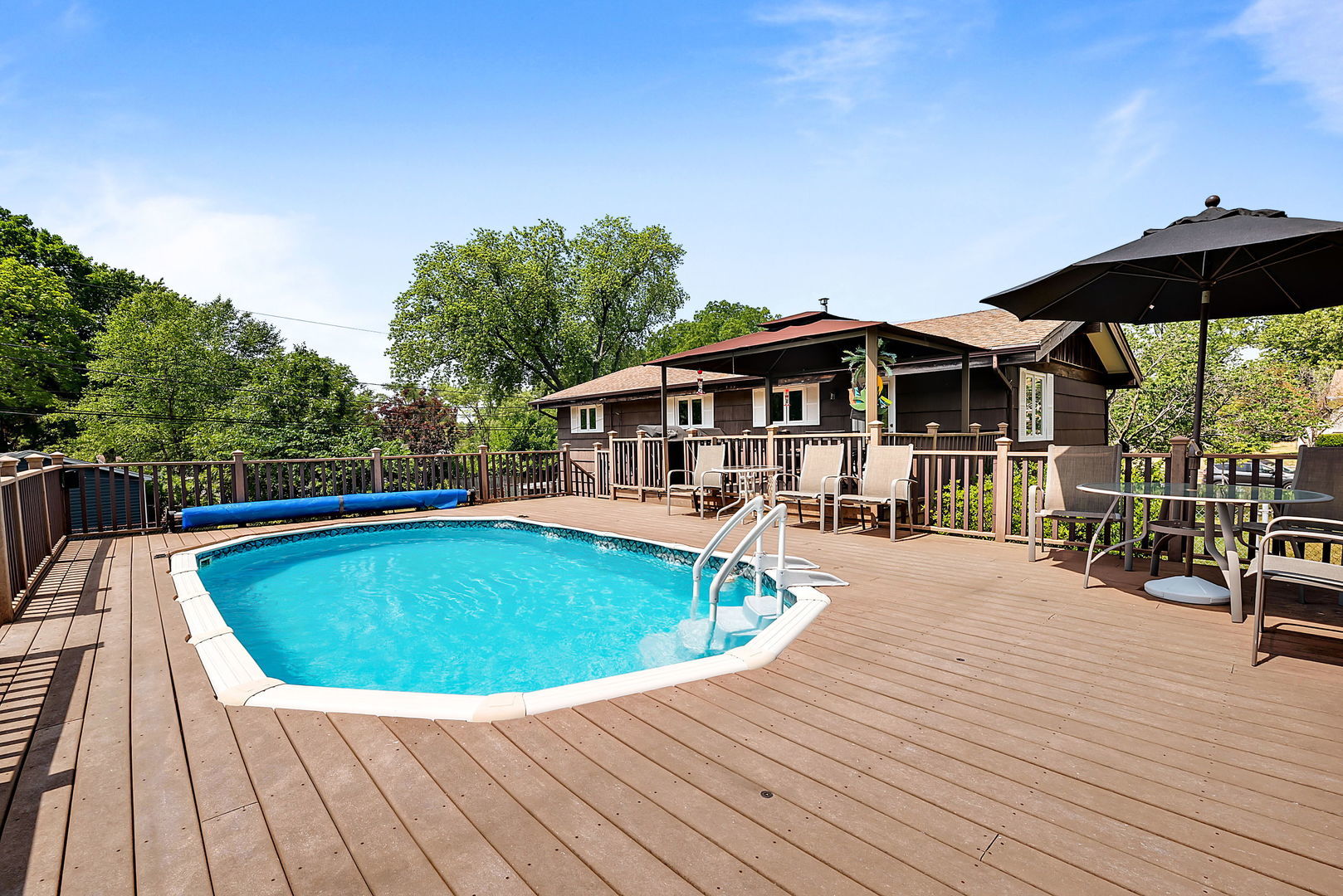 5341 Meadow Lane Lisle, IL 60532 - Photo 15 of 16 a view of a house with pool and sitting area