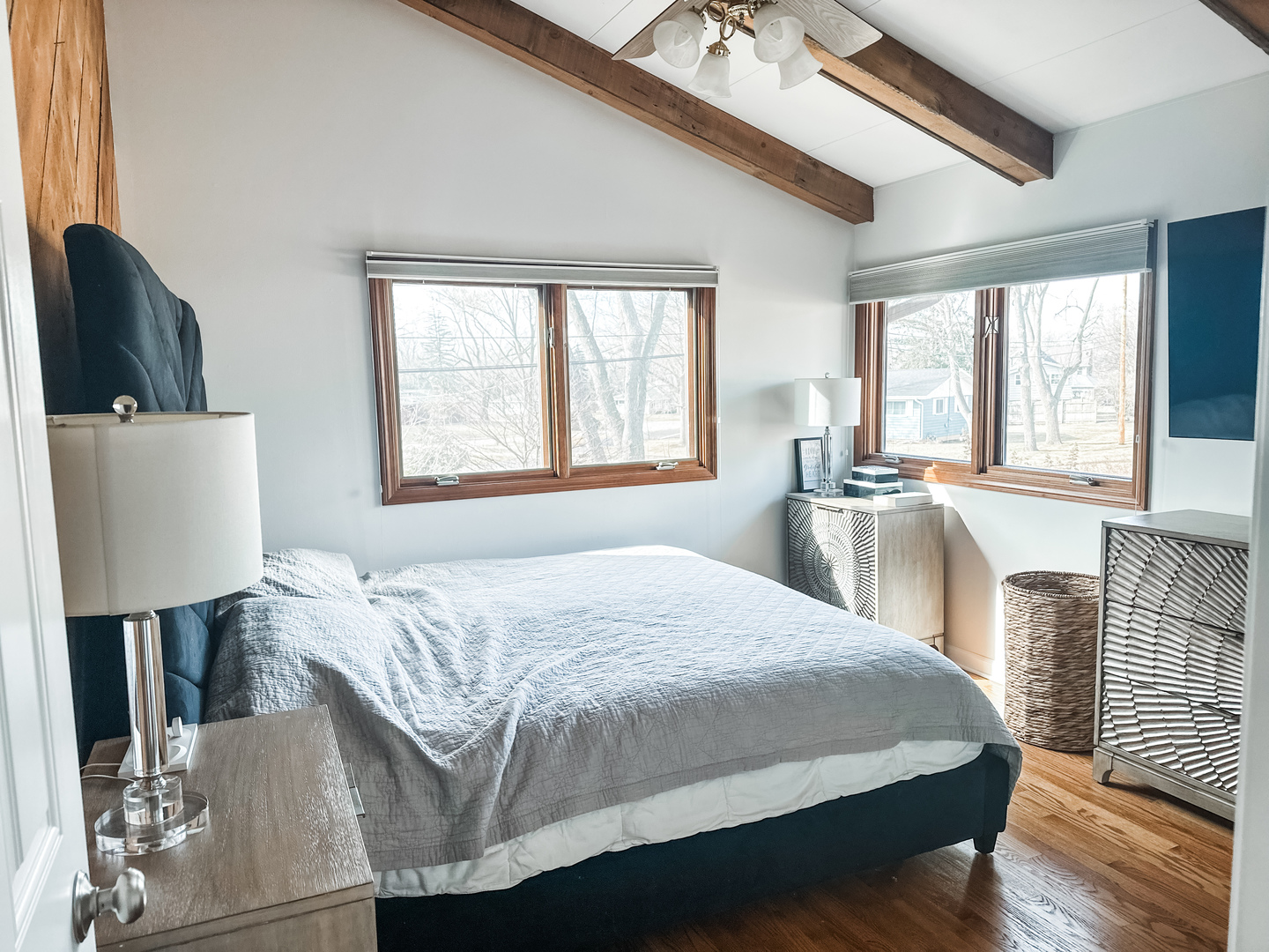 5341 Meadow Lane Lisle, IL 60532 - Photo 6 of 16 a bedroom with a bed a couch and dresser with wooden floor